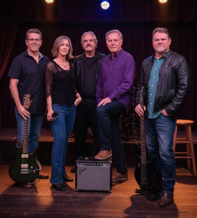 Group shot of Midnight Vinyl with stage lights and an amplifier